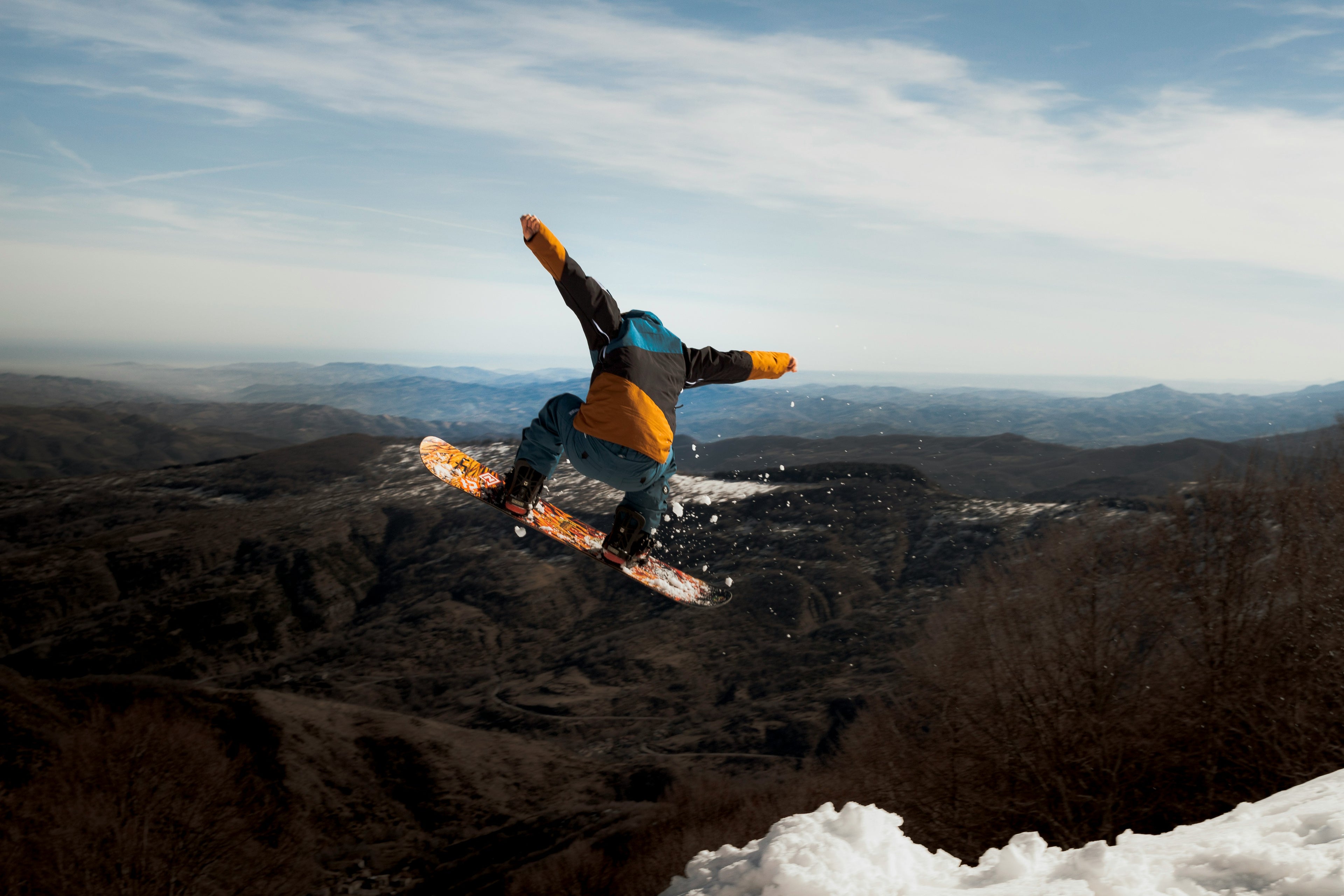 Snowboarding mid air jump